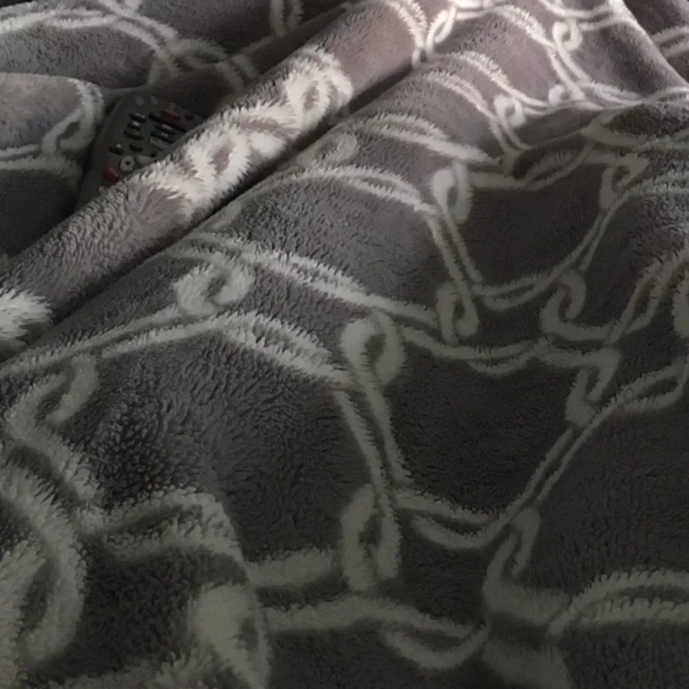 Gray and white fleeced blanket